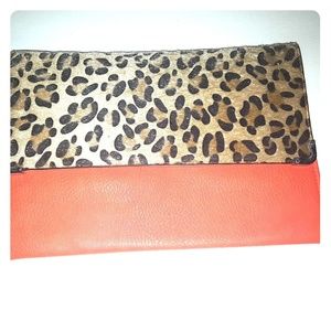 Orange leather clutch with leopard flap